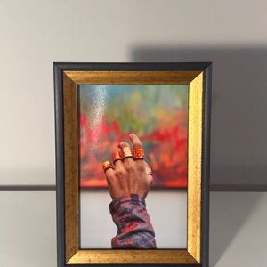 Vibrant Gold and Black Framed Art Piece